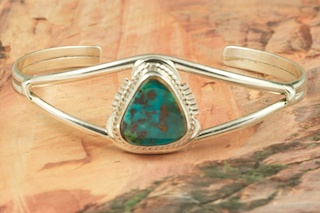 Genuine Pilot Mountain Turquoise set in Sterling Silver Bracelet. The Pilot Mountain Mine is located in Esmeralda County, Nevada. Created by Navajo Artist Margaret Platero. Signed by the artist.